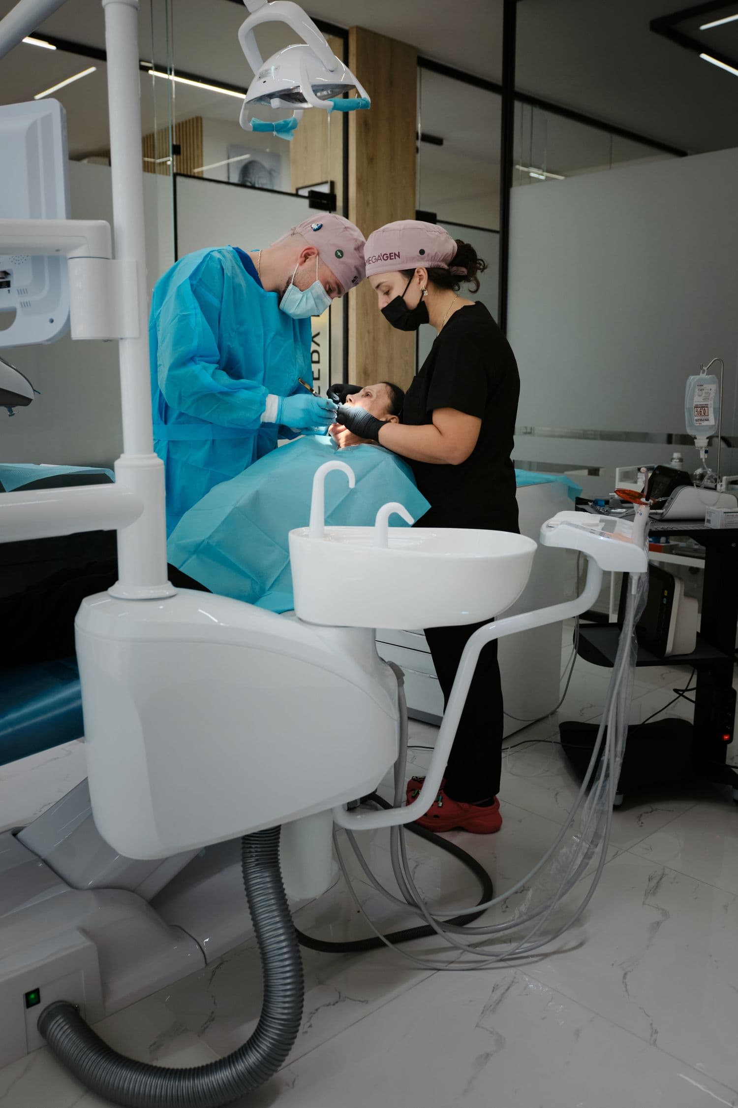 Dental team at Aura Clinic during a precision treatment